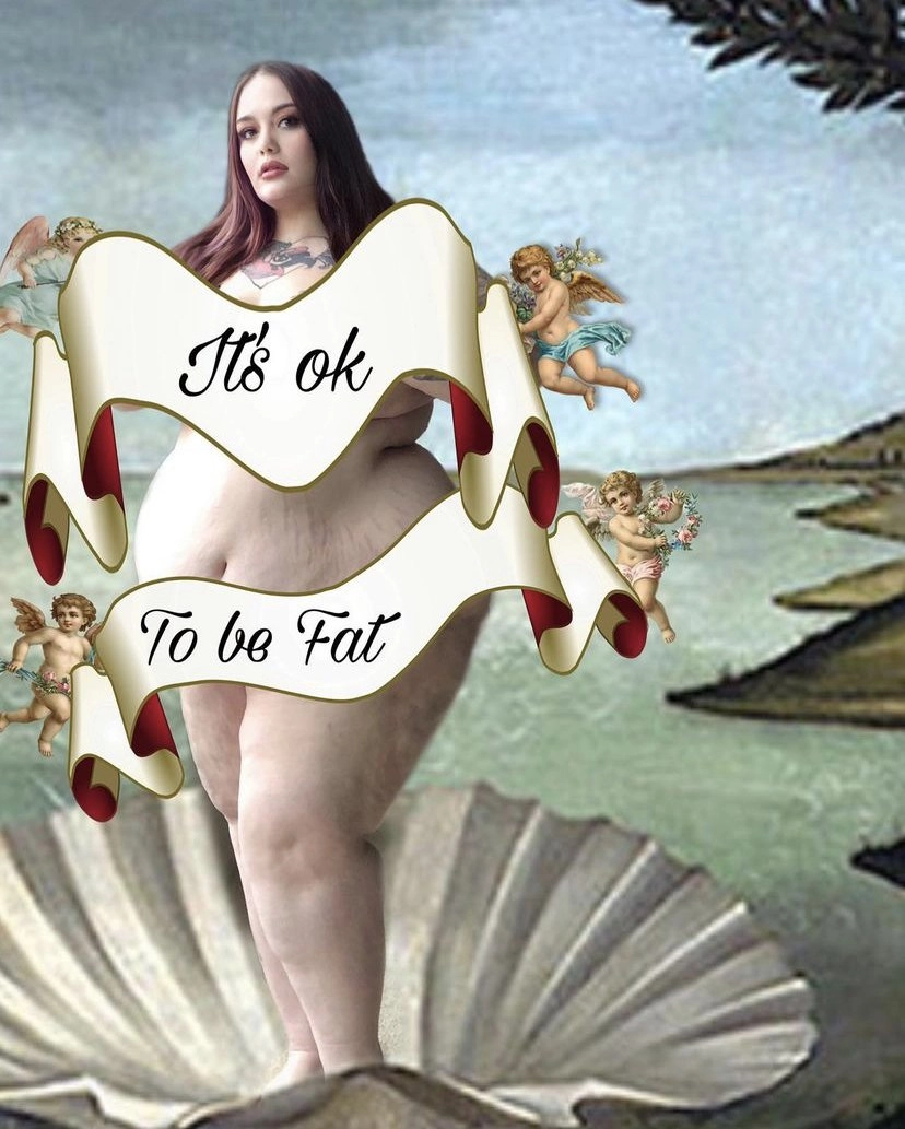 A digitally manipulated image parodying Sandro Botticelli's 'The Birth of Venus'. A plus-size woman is superimposed over the painting, standing on a clam shell against the backdrop of the sea. Two cherubs holding floral garlands are on either side of her, and a large scroll banner is placed across her body that reads, 'It's ok To be Fat'.