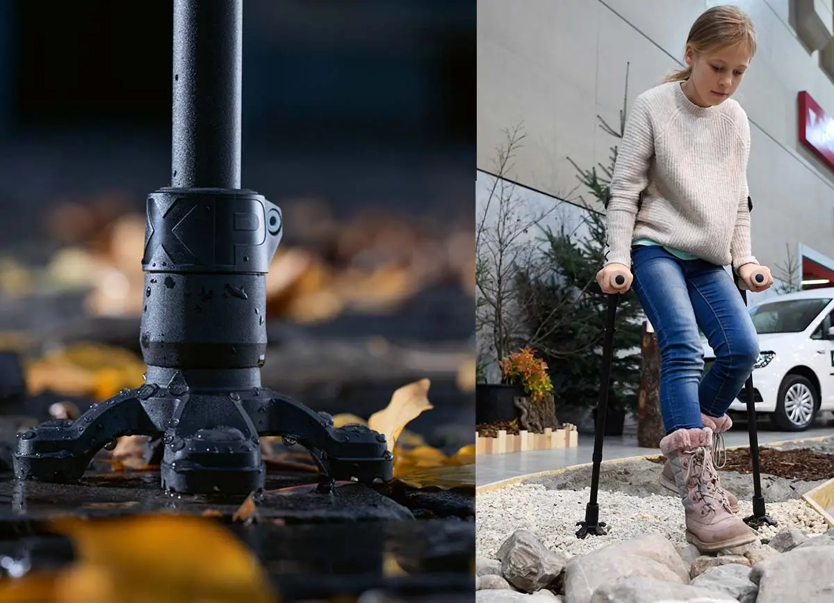 A two-panel image showing a specialized crutch foot. The left side is a close-up of a black, multi-pronged crutch foot standing on a wet, rocky surface covered in autumn leaves. The right side shows a young girl using two black forearm crutches, each with a similar multi-pronged foot, to walk over an uneven, rocky, indoor landscape display while wearing jeans, a beige sweater, and pink-cuffed winter boots.
