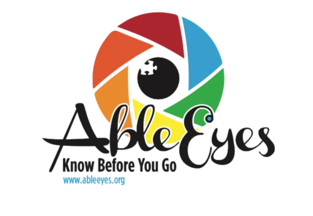 A logo made of multiple colors of wedges form the shape of an iris with a black pupil inside. Text is, Able Eyes: Know before you go.