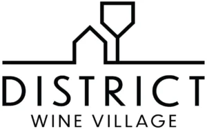 A black and white logo for "DISTRICT WINE VILLAGE." The graphic element above the text features a simplified outline of a building or house silhouette merged with the outline of an inverted wine glass above it, all resting on a strong horizontal line. The word "DISTRICT" is in a large, bold, sans-serif font, and "WINE VILLAGE" is in a smaller, lighter font underneath.