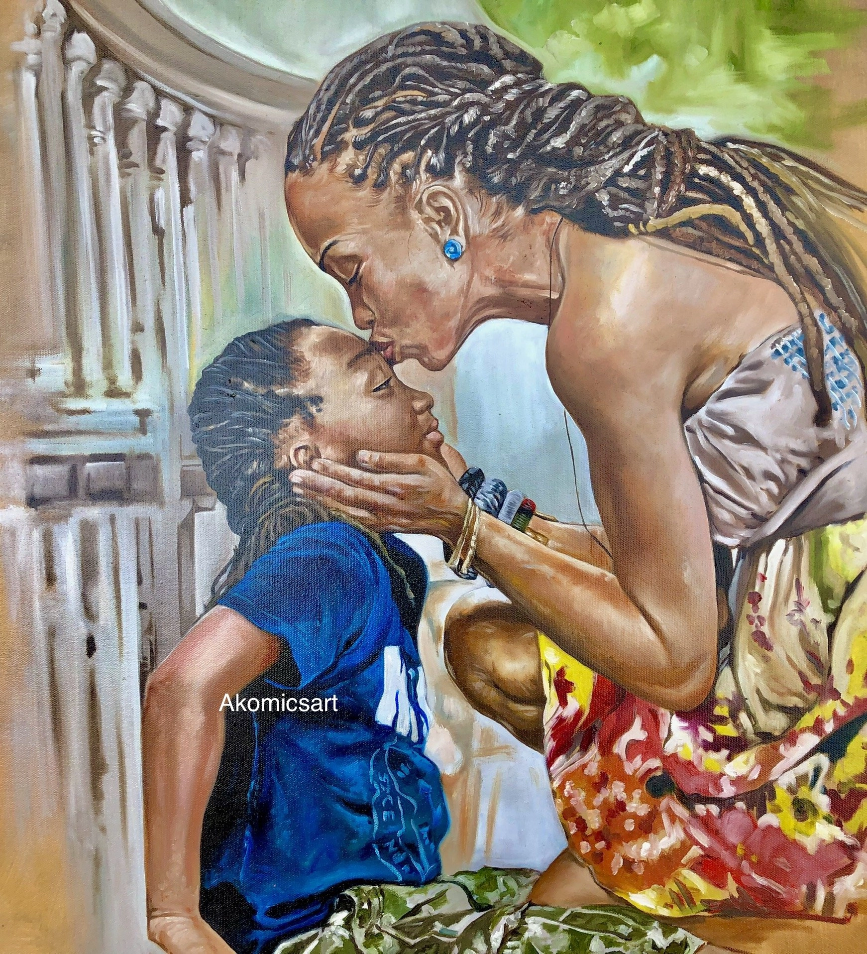 A hyperrealistic oil painting depicting an African woman with dreadlocks, wearing a printed skirt and strapless top, gently kissing the forehead of a child with similar hair, whose face she cradles with both hands. They are situated next to a stone balustrade. The artist's signature, "Akomicsart," is visible near the bottom left.