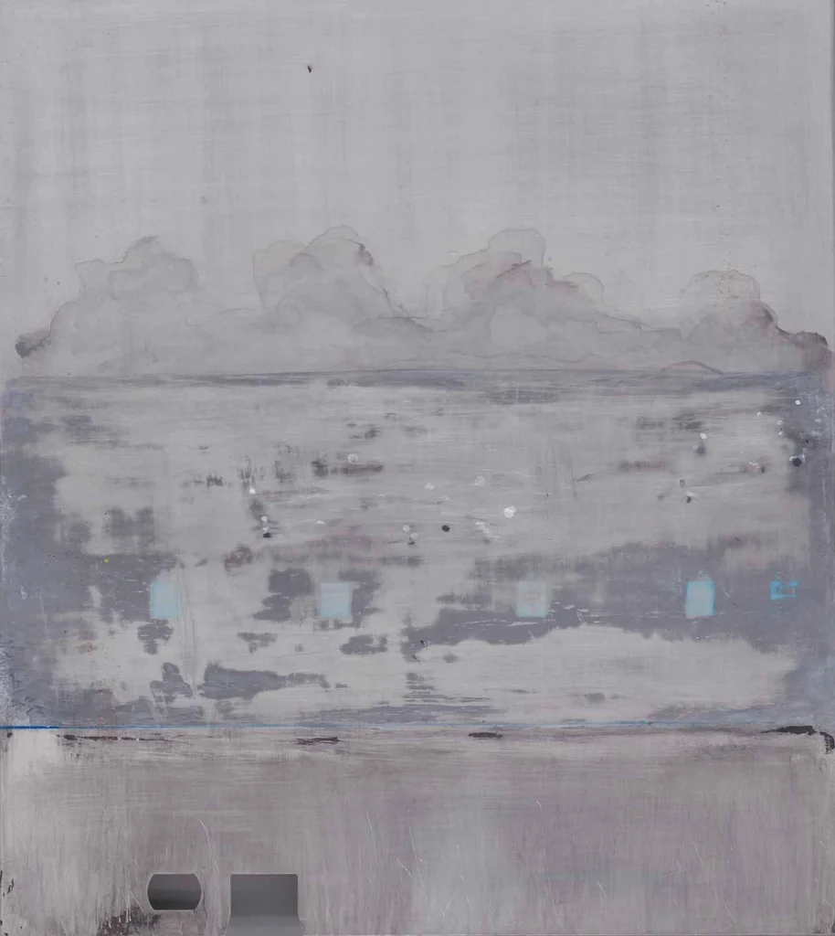 A large, vertical abstract painting rendered in shades of gray, white, and a hint of blue. The composition is horizontally divided, with the top featuring soft, cloud-like forms rendered in washes. The middle section is a textured, heavily-worked field of gray with small, light-blue rectangular patches. The bottom is a solid, lighter gray area.