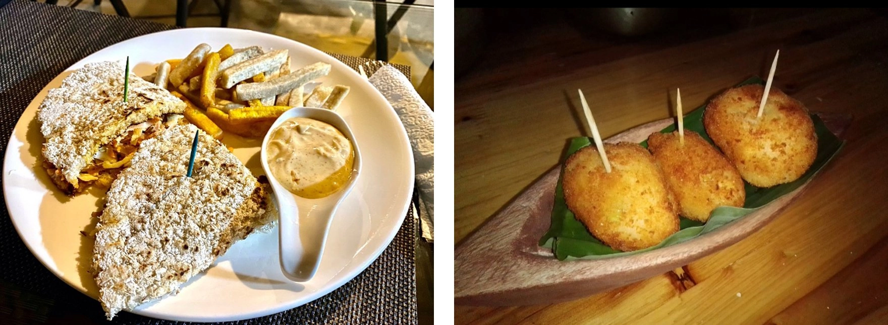 A split image showing two different food plates. The image on the left features a white plate with two triangular pieces of a crispy, breaded sandwich, served with french fries, sliced taro root (malanga or yautía) sticks, and a white spoon-shaped dish containing a light brown dipping sauce. The image on the right shows three round, golden-brown fried croquettes or fritters, each skewered with a toothpick, arranged on a long, boat-shaped wooden serving dish lined with a banana leaf.