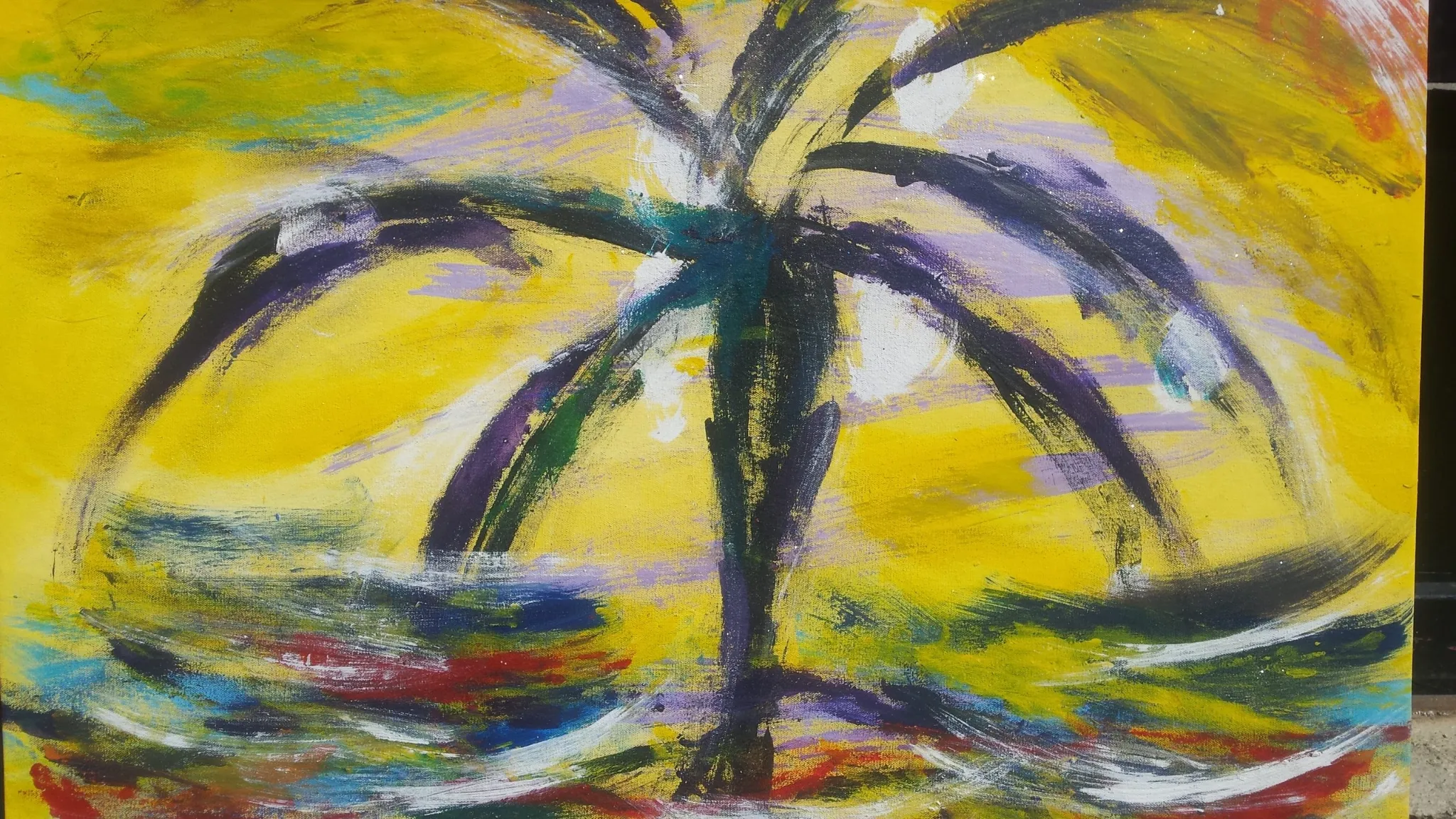 An expressive, abstract painting featuring a dark silhouette of a palm tree against a bright, vivid yellow background. The foreground is filled with loose, swirling brushstrokes of red, blue, green, and white paint, suggesting water or strong wind.