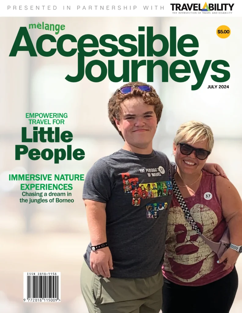 Cover of the magazine 'Accessible Journeys' presented in partnership with TravelAbility. The headline reads 'Empowering Travel for Little People'. The subheadline reads 'Immersive Nature Experiences: Chasing a dream in the jungles of Borneo'. The cover features a smiling young man with curly hair wearing a dark t-shirt and a woman with sunglasses wearing a sleeveless top. They appear to be enjoying their time together. The price of the magazine is $5.00, and the ISSN barcode is visible at the bottom left.