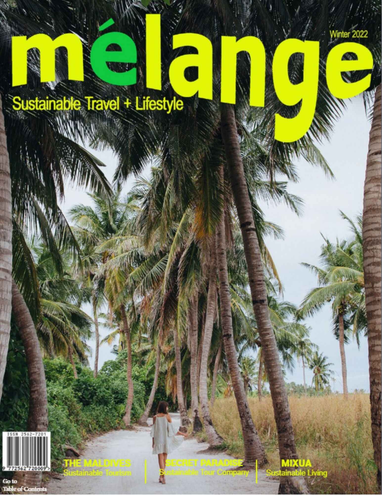 The cover of mélange magazine, titled "Sustainable Travel + Lifestyle," features a serene tropical scene. A woman in a light summer dress walks down a sandy path lined with towering palm trees. The lush greenery and blue sky frame the tranquil setting, evoking a sense of calm and adventure. The cover highlights features like "The Maldives: Sustainable Tourism," "Secret Paradise: Sustainable Tour Company," and "Mixua: Sustainable Living." The bright, bold yellow and green fonts stand out against the natural background, promoting an eco-conscious travel theme for Winter 2022.