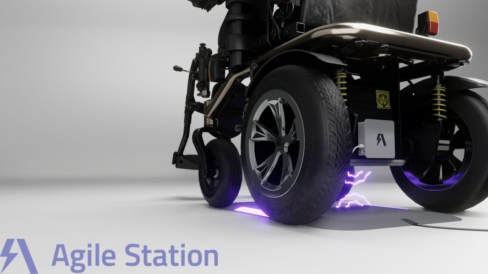 A close-up of a sleek, modern electric wheelchair featuring large, sturdy tires and shock absorbers. The image highlights a charging pad on the ground beneath the wheelchair, emitting a faint purple glow and lightning-like effect, indicating wireless charging in progress. The wheelchair is branded with the logo "Agile Station" in the bottom left corner, with a stylized "A" icon. The design suggests a focus on innovation, mobility, and advanced technology.