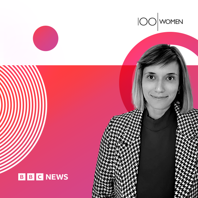 The image shows a promotional graphic featuring a woman in black and white, dressed in a houndstooth-patterned blazer with a high-neck black top underneath. The background consists of a bold, gradient design with shades of pink, red, and white, containing geometric circles and patterns. The top right corner has the text "100 WOMEN," and the bottom left corner features the "BBC NEWS" logo. The design is clean and modern, emphasizing the subject's significance as part of the "100 Women" initiative.