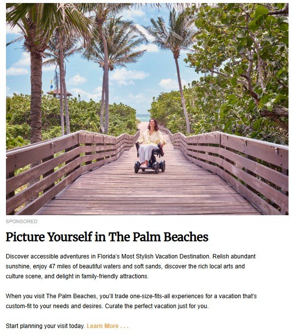 A woman in a motorized wheelchair smiles while crossing a wooden boardwalk surrounded by palm trees and greenery, with a bright blue sky in the background, promoting accessible travel in The Palm Beaches, Florida