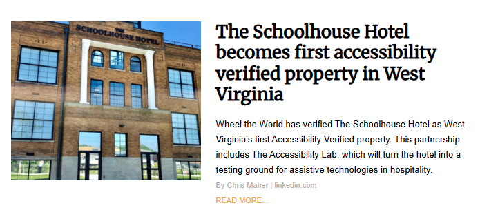 The exterior of a multi-story brick building with the name 'The Schoolhouse Hotel' on its facade.