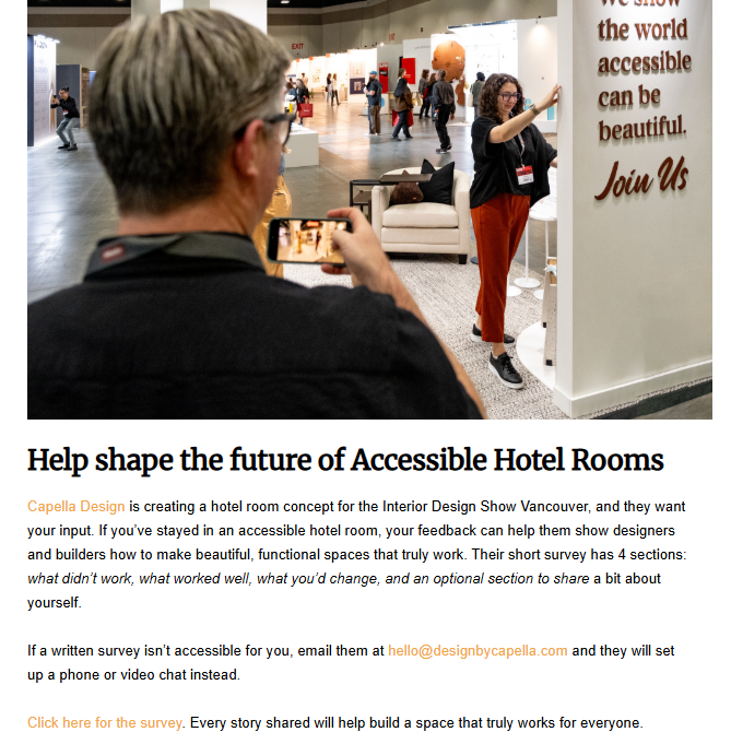 A person holds up a smartphone to film a woman standing next to a large sign that reads, 'We show the world accessible can be beautiful. Join Us.
