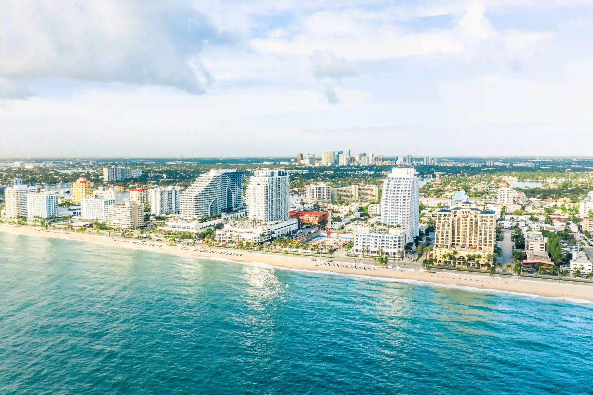 Accessible cruise port in Fort Lauderdale with beachfront hotels, resorts, and skyline near Port Everglades.