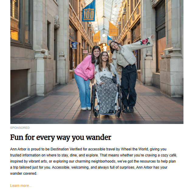 three young women posing for a picture in a covered outdoor walkway with storefronts on both sides. The woman in the center is in a wheelchair. The article headline is "Fun for every way you wander