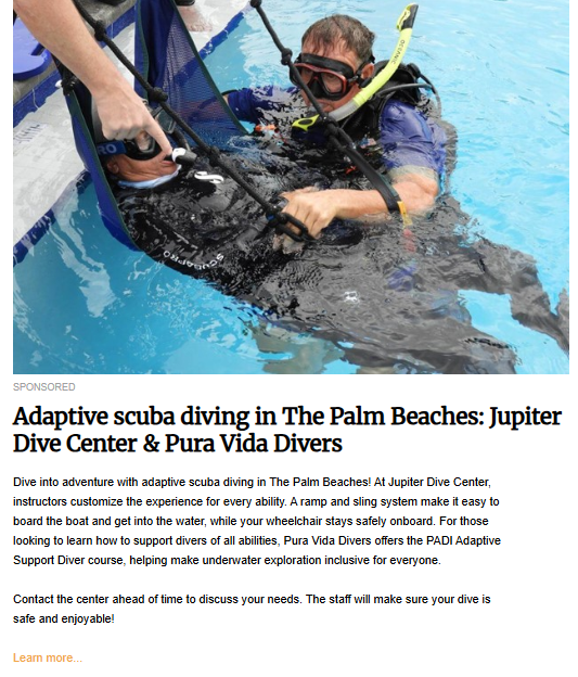A man wearing a black snorkel mask and fins is being gently lowered into a bright blue swimming pool using a blue sling system attached to overhead rigging. An assistant's hands are visible helping to guide the sling. The image illustrates adaptive scuba diving with the headline "Adaptive scuba diving in The Palm Beaches: Jupiter Dive Center & Pura Vida Divers."