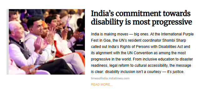 A candid photo of several men, most wearing formal Indian attire, seated and applauding during a public event, likely the International Purple Fest in Goa as referenced in the accompanying article. The men are facing toward a stage or focal point, and the audience is visible behind them. The article headline is "India's commitment towards disability is most progressive."