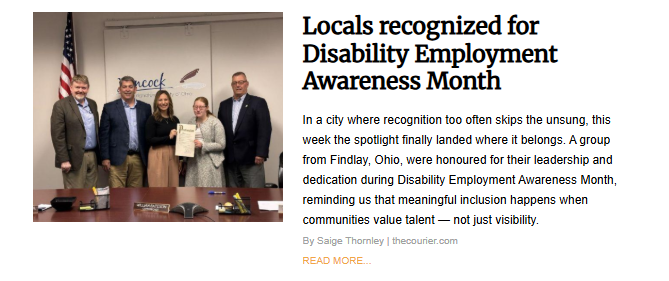A group of five people, three men and two women, stand together in a formal office setting in front of an American flag and a city seal that says "Hancock." The woman in the center holds a framed document or proclamation. The image accompanies the article "Locals recognized for Disability Employment Awareness Month" in Findlay, Ohio.