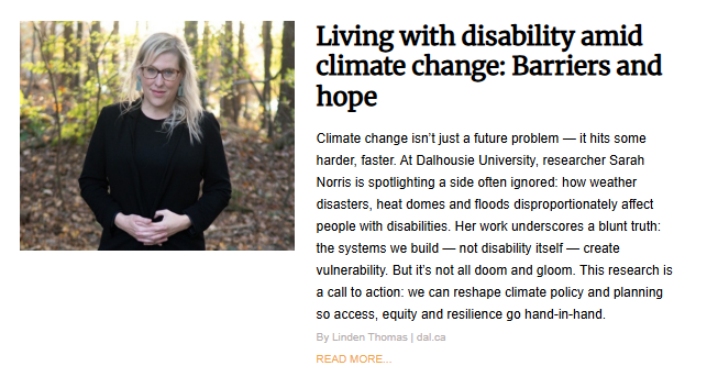 Researcher Sarah Norris, a blonde woman in glasses and a black blazer, standing outdoors among trees, illustrating an article about living with disability amid climate change.
