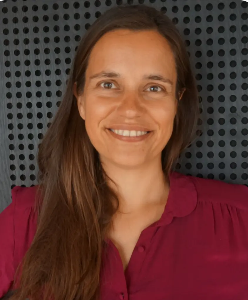 Professional headshot of Lise Pape, founder of Walk With Path, smiling in front of a modern acoustic panel background.